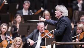 Sir Simon Rattle conducts the London Symphony Orchestra, whose performances are free to view on YouTube. Photo: Tristram Kenton