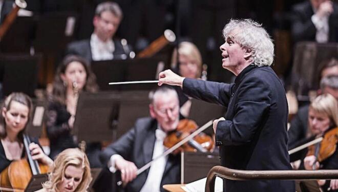 Sir Simon Rattle conducts the London Symphony Orchestra, whose performances are free to view on YouTube. Photo: Tristram Kenton