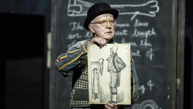Steven Beard as Howison, explains a phenomenon in Giant, at the Royal Opera House. Photo: Camilla Greenwell