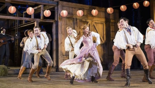 Laura Pitt-Pulford as Milly with the Brothers: Open Air Theatre Seven Brides for Seven Brothers photo by Helen Maybanks