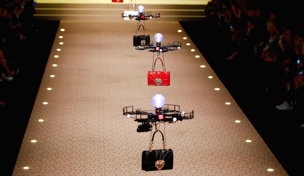 A fleet of drones carrying bags at D&G's AW18 show 