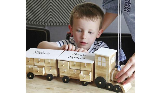 For their first Christmas: Personalised Wooden Train Advent Calendar, £39