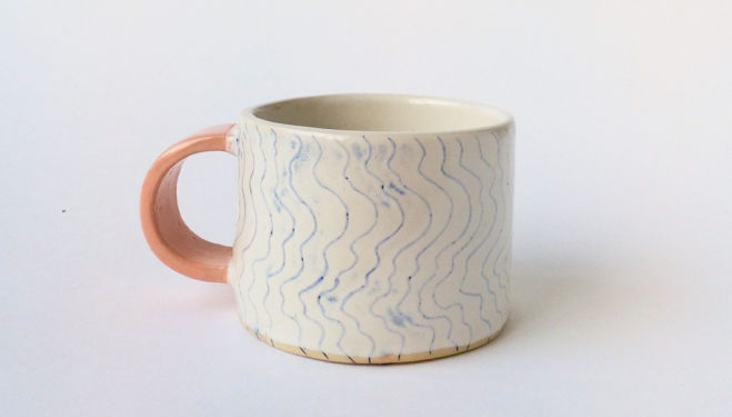 Anne Beam eramic stoneware mug with pink handle and delicate waves pattern.  6.5 x 9cm