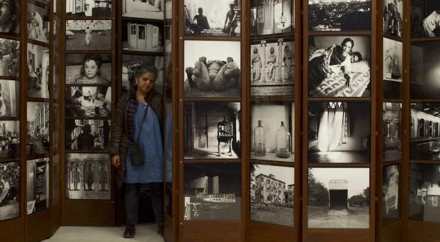 Dayanita Singh stands with the Museum of Chance. Courtesy the artist and Frith Street Gallery, London. © The artist 2013