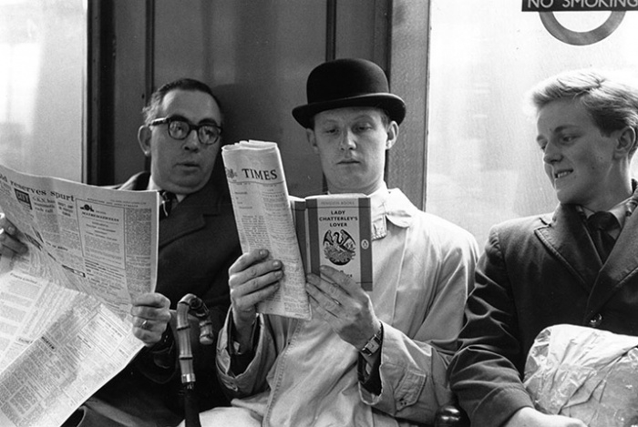 1960: Fox photographer George Freston poses as a commuter on the tube, reading a copy of D H Lawrence's novel Lady Chatterley's Lover, on the day the book went on ...
